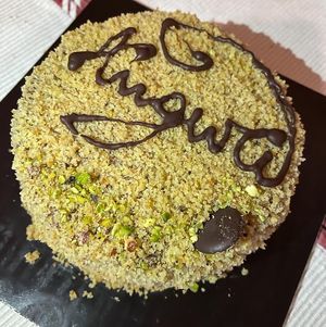 Delicious birthday cake with pistacchio and chocolate cream  at Wani Vegan Bakery in Rome