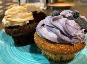 Blueberry cupcake and chocolate cupcake with peanut cream frosting  at Wani Vegan Bakery in Rome