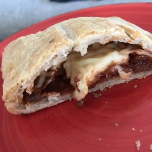 Sfogliatina tomatoes onions and vegan cheese  at Wani Vegan Bakery in Rome