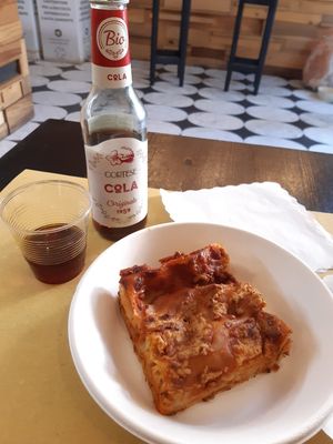 Lasagna and cola at Wani Vegan Bakery in Rome