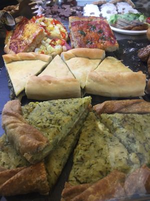 Quiches and pizza at Wani Vegan Bakery in Rome