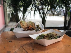 Chili cheese burrito and savory and al pastor tacos! at Black Flamingo in Brooklyn