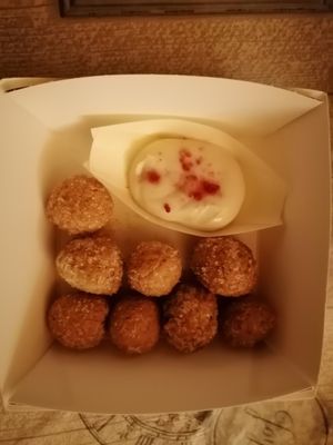 Castagnole con Crema pasticcera at Black Sheep Raw • Vegan Lab & Bistrot in Trento