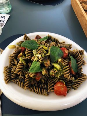 Pasta con farina di sole lenticchie con pomodorini confit, basilico, mandorle tostate, melanzane arrosto e porro.  at Black Sheep Raw • Vegan Lab & Bistrot in Trento