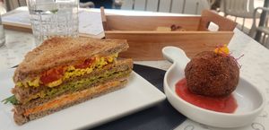 Club sandwich (4,5€) and arancino (4€). at Black Sheep Raw • Vegan Lab & Bistrot in Trento