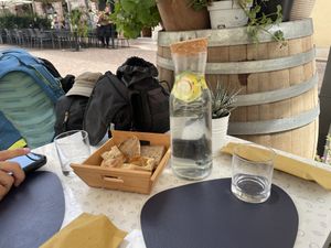 Coperto covers fruit infused water and amazing bread  at Black Sheep Raw • Vegan Lab & Bistrot in Trento