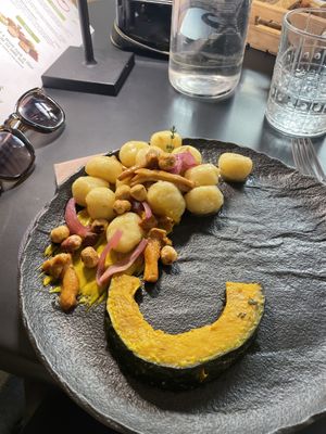 Gnocchi di patate con zucca cipolla nocciole   at Black Sheep Raw • Vegan Lab & Bistrot in Trento