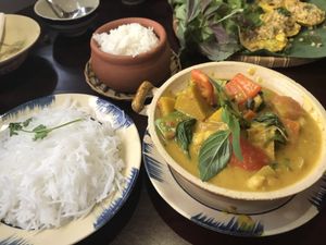 This is the pumpkin curry with sides of rice and vermicelli.
chickpeas, black beans, tofu, pumpkin, peppers, onions, basil and coconut milk  at Pi Vegetarian Bistro in Ho Chi Minh City