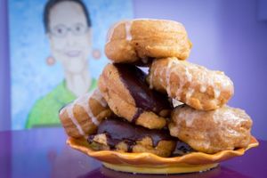 sample of donuts with Nana in the background at Nana's Donuts in Charleston