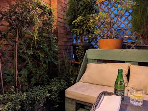 Cozy, green corner at Veganic in Krakow