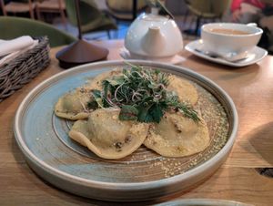 Raviolo filled with spinach and dried tomatoes. Delicious! at Veganic in Krakow