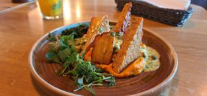 Marinated Tempeh on Carrot Purée in Miso-Caper Sauce at Veganic in Krakow