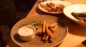 POLENTA CHIPS / HUMMUS IN THE BACKGROUND at Veganic in Krakow