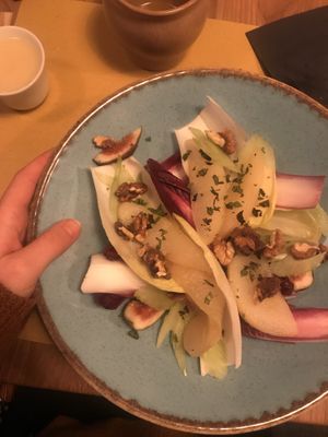 Pear and fig salad with walnuts and miso-tofu dressing 😍😍 at Veganic in Krakow