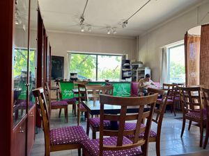 Seating with the food counter at the end   at Garda Pupa in Riga