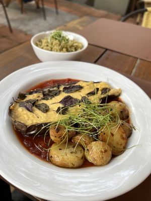 Parmigiana with pesto rice 😍  at Casa Raw in Sao Paulo