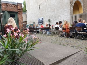 Outdoor seating in the backyard during summer at Godt Brød in Oslo