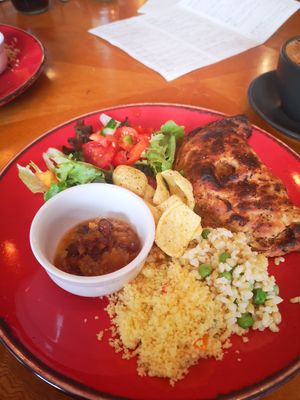 Picture of a red plate with a Guinness pasty, served with salad at Planetwise & Yoga Studio in Bridlington