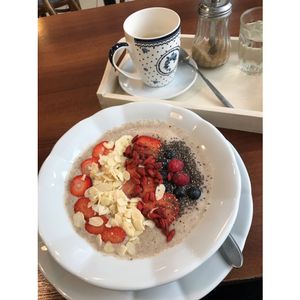 Buckwheat porridge with fruits and nuts - with soy milk instead of dairy milk! It was my first time having buckwheat porridge and the texture is a little frothy but super yummy!! at Veget in Prague