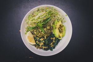 Greeny Bowl: Brown Rice, Massaged Kale, Avocado, Sprouts, Pesto, and Pumpkin Seeds. at Nourish Wellness Cafe in Northampton
