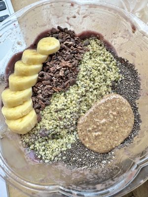 Açaí bowl w/ banana, cacao nibs, hemp+chia seeds, & almond butterr  at Nourish Wellness Cafe in Northampton