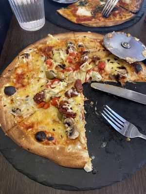 Vegetable pizza with vegan cheese   at Cafe Sia in Isle Of Skye