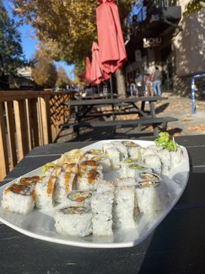 Enoki roll, garden spider roll, green dragon roll, and tofu maki roll.  at UCHU Sushi in Portland