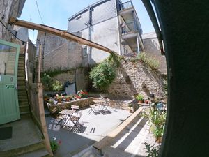 Sunny cafe courtyard with retractable sail canopy to escape rain! at Sprout Health Foods in Newquay