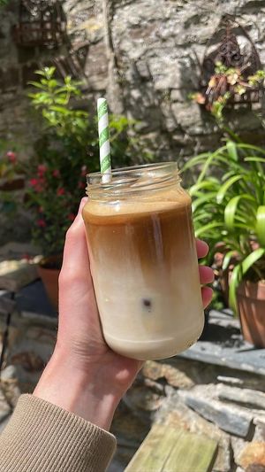 Iced oat latte - enjoyed best in our sunny courtyard setting. at Sprout Health Foods in Newquay