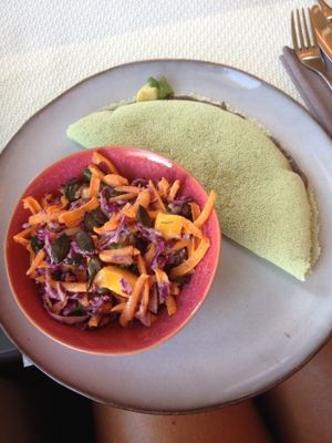 Tapioca crepe with black bean houmous, avocado, corn and tomatoes and a salad with red cabbage, grated carrots, mango and pumpkin seeds.  at Wild Girls Deli in Geneva