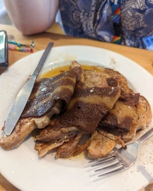 French toast with bacon and syrup. at Green Kitchen in Brighton