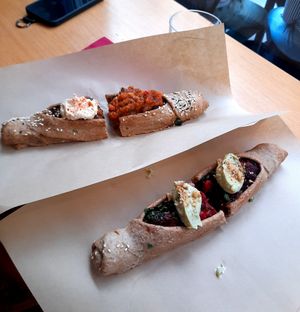 Vegan 'acrobatic' pies with beetroot - top has salsa and hummus (nut free option), bottom has avocado and walnut topping at Feyrouz in Athens