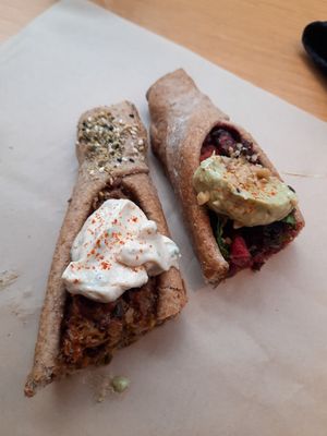 Left: lentil pie topped with creamy hummus. Right: beetroot pie topped with avocado and walnut at Feyrouz in Athens