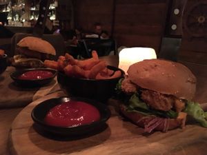 Plant-based chicken burger and sweet potato fries at The Hold in Manly