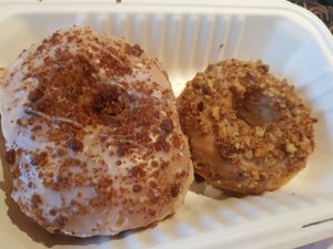 Rum flavour special donut and maple walnut donut. at Cartems Donuts - Kitsilano in Vancouver