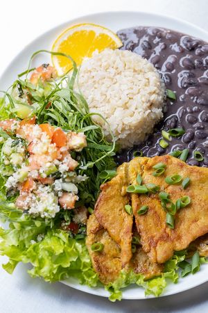 Vegan chicken fillet with brown rice, beans and salad. at SuBte Vegan in Sao Paulo