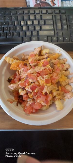 Special Style Fries with added tomato 🍅 😋 at Next Level Burger - Lake Oswego in Lake Oswego