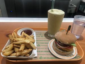 Signature burger, baked French fries, and pumpkin spice milkshake! So good! at Next Level Burger - Lake Oswego in Lake Oswego