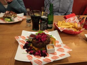 open vegan burger with fries at Steak Cattle & Roll - Sauchiehall St in Glasgow