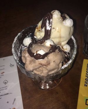 salted caramel ice cream and chocolate ice cream on top of a warm chocolate brownie  at The Deaf Institute Bar and Kitchen in Manchester