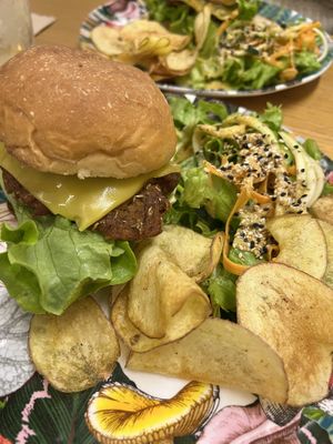 Vegan burger of the day with side salad and crisps  at O Xexexe in Costa Da Caparica