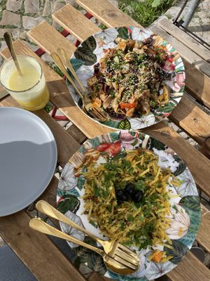 Portuguese special (closest) and yakisoba, along with house juice   at O Xexexe in Costa Da Caparica