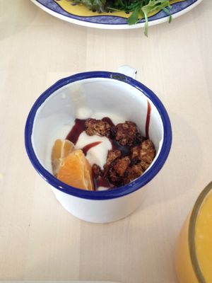 Yoghurt with musli, chocolate, date syrup and fruit at O Xexexe in Costa Da Caparica