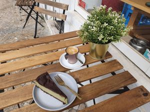 Vegan matcha chocolate cheesecake with some tasty coffee on the side at O Xexexe in Costa Da Caparica