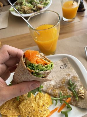 Tofu veggie wrap with fresh local orange juice   at Alfarroba Cafe in Albufeira