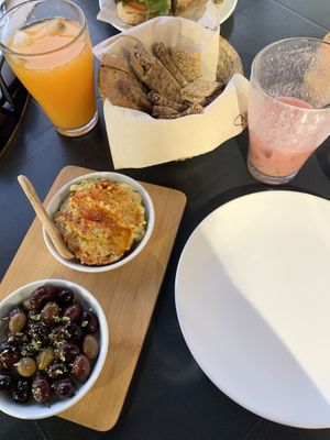 bread, hummus and olives such as freshly pressed orange juice and the Smoothie  at Alfarroba Cafe in Albufeira