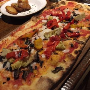 Vegan Rustica pizza with artichokes, mixed peppers, and mushrooms at Zizzi in Kingston Upon Thames