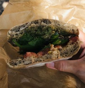 Vegetarian sandwich made vegan without cheese, delicious homemade pesto and roasted veg at PiqNiq in Menorca