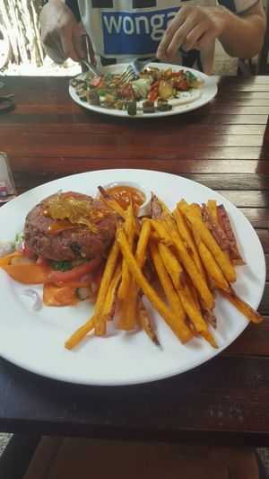 veggie burger (vegan/bunless) and sweet potatoe fries at The Veg G Table Cafe in Siem Reap