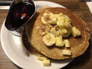 Hawaiian Pancakes with vegan batter & I substituted the whipped cream for 100% maple syrup! (topped with pineapple, banana & macadamia nut) at Slappy Cakes in Lahaina